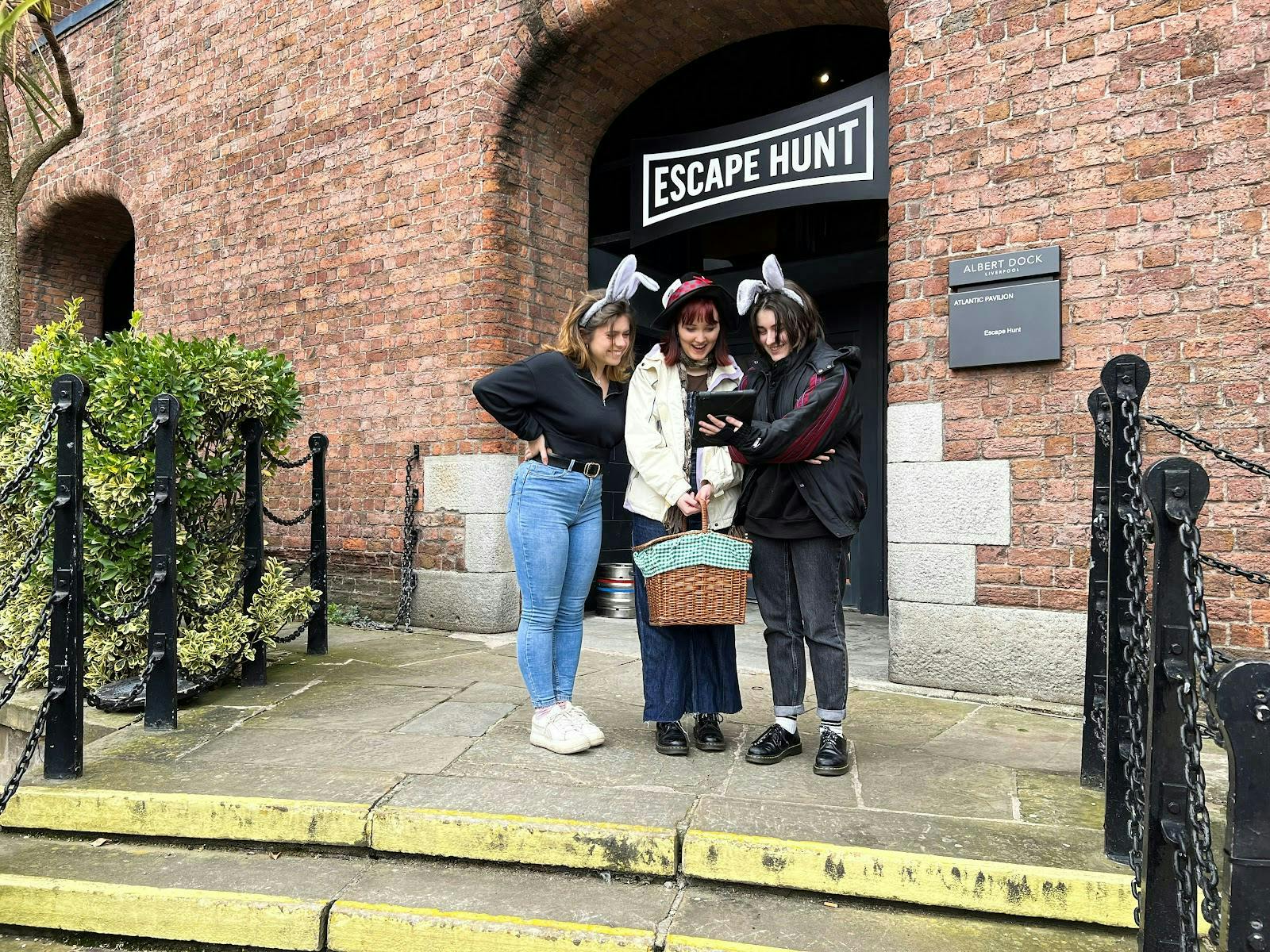 Group outside Escape Hunt London, playful attire for team-building event.