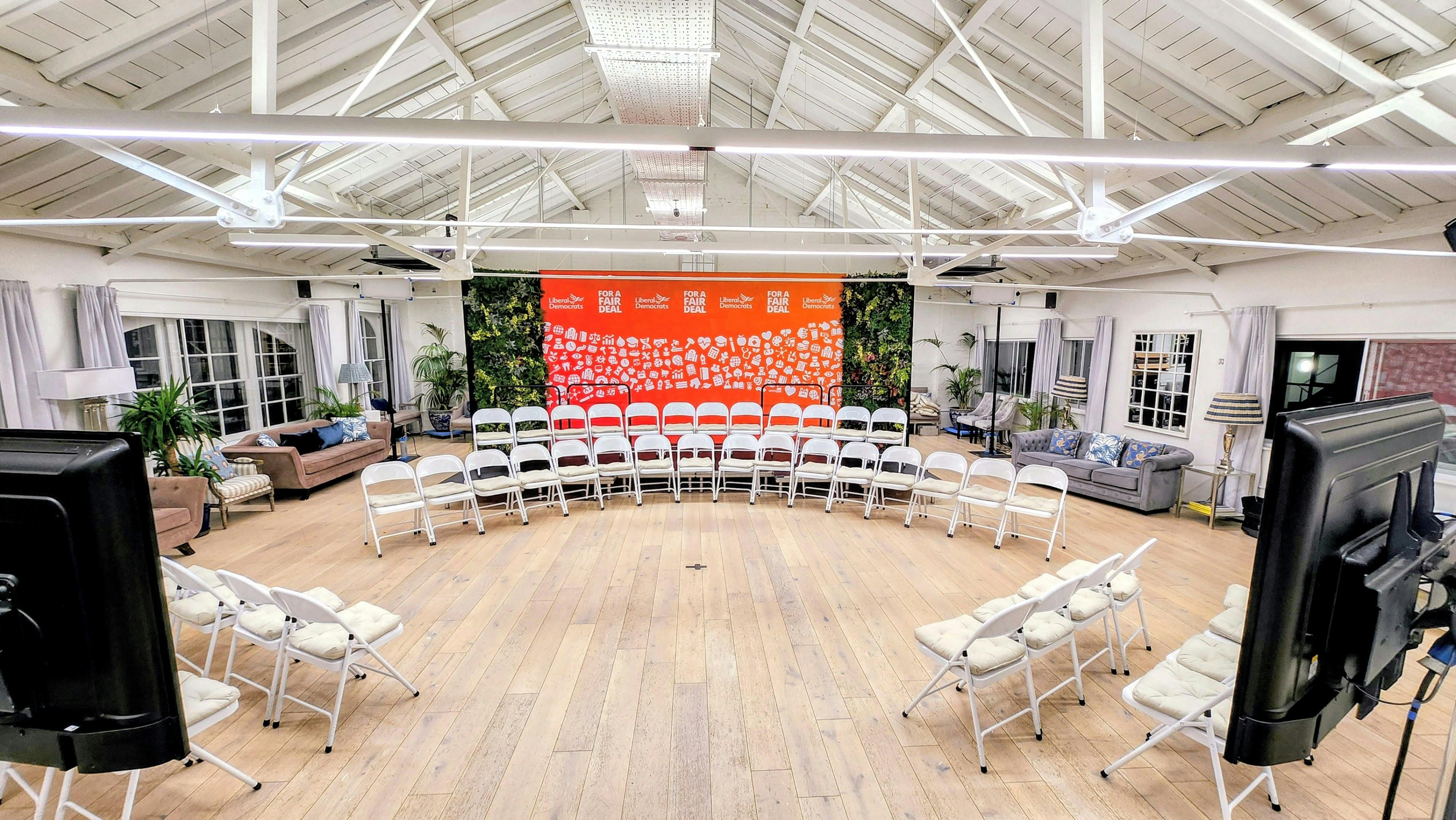 Collaborative meeting space with circular seating for workshops and brainstorming sessions.