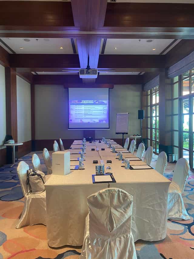 Meeting room setup at Sofitel Singapore with projector for professional event.