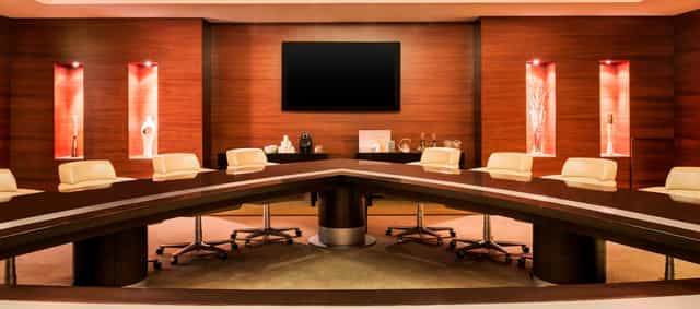 Modern conference room in Abu Dhabi with sleek table, ideal for executive meetings.