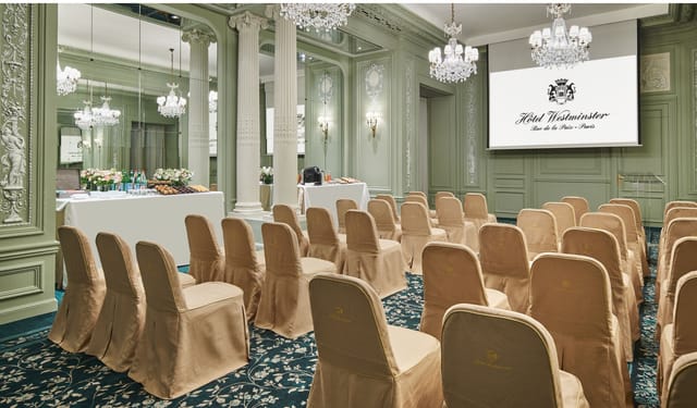 Elegant meeting space at Hotel Westminster Paris with plush seating for corporate events.