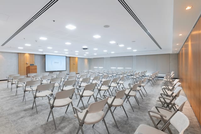 Modern conference room in Dubai with rows of chairs for corporate events.