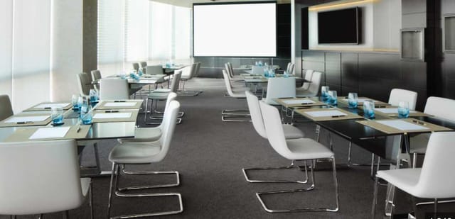 Modern meeting suite in Jumeirah Emirates Towers, perfect for corporate workshops.