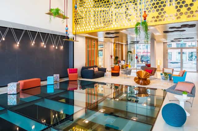 Modern lobby at Pow Wow 1, Capri by Fraser Berlin, ideal for networking events.