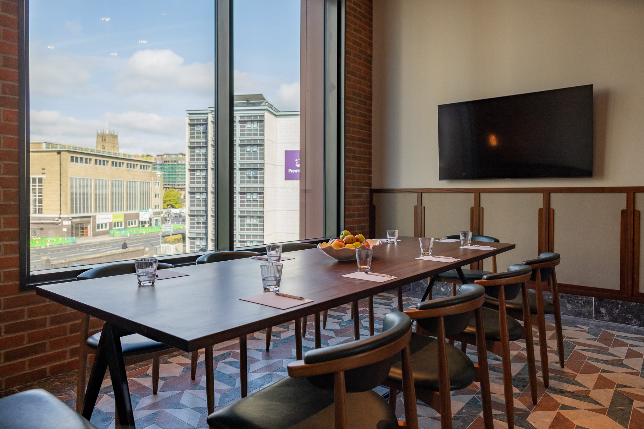 Boardroom at Cleaver & Wake with wooden table, ideal for meetings and events. - Banner