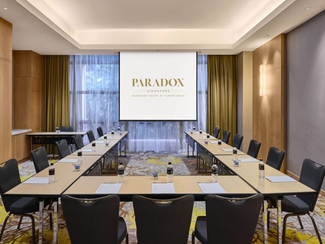 Oakwood Room at Paradox Singapore: modern meeting space with U-shaped table setup.