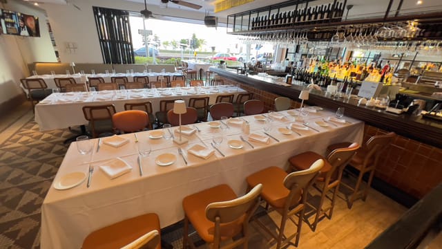 Semi-VIP event space with elegant dining table at Spasso Restaurant & Bar, ideal for gatherings.