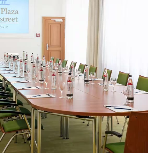 Nasdaq meeting room in Berlin with a long table, ready for corporate events and discussions.