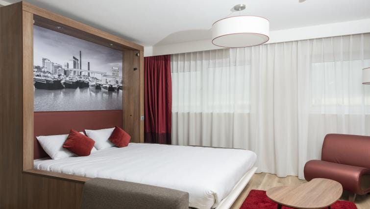 Modern studio room with murphy bed at Adagio Serviced Apartments for business travelers.