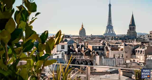 Rooftop view of Paris with Eiffel Tower, ideal for corporate retreats and events.