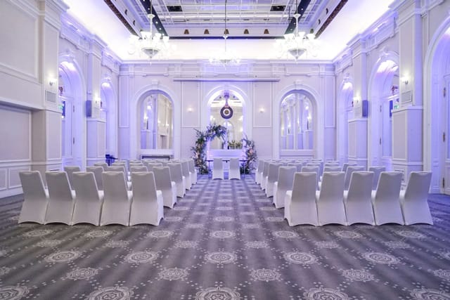 Baccarat Ballroom at Hilton Paris Opera, elegant wedding venue with purple lighting.