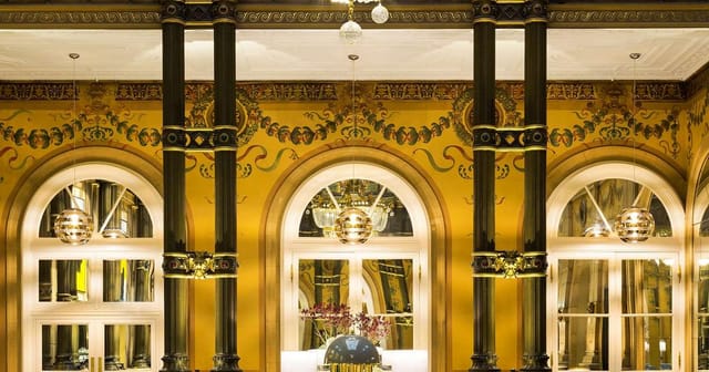Baccarat Ballroom at Hilton Paris Opera: elegant event space with ornate walls, ideal for gatherings.