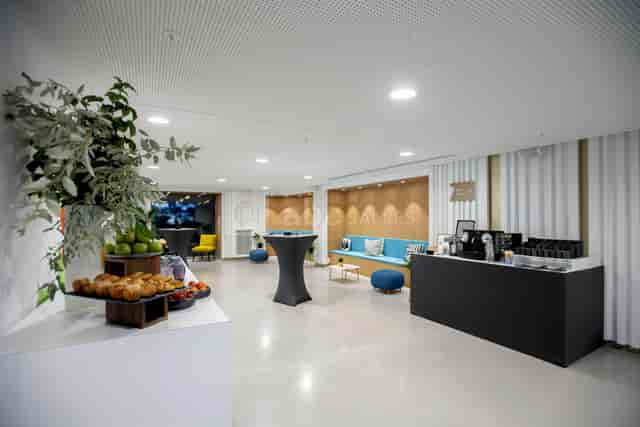 Modern event space with comfortable seating for networking in Prestige Sodexo Collection.