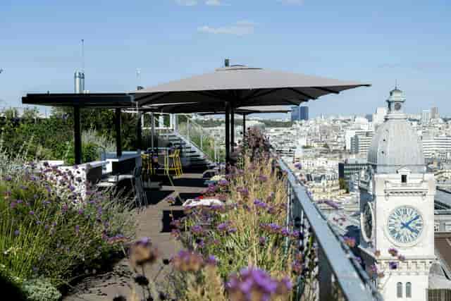 Rooftop venue with stylish seating and city view for events and gatherings.