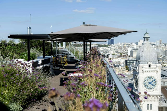 Rooftop venue with stylish seating and city view for events and gatherings.