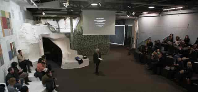 Engaging speaker in unique event space at Palais de Tokyo for creative workshops.
