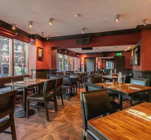 Semi-private dining area at Hard Rock Cafe Amsterdam, perfect for intimate events and meetings.