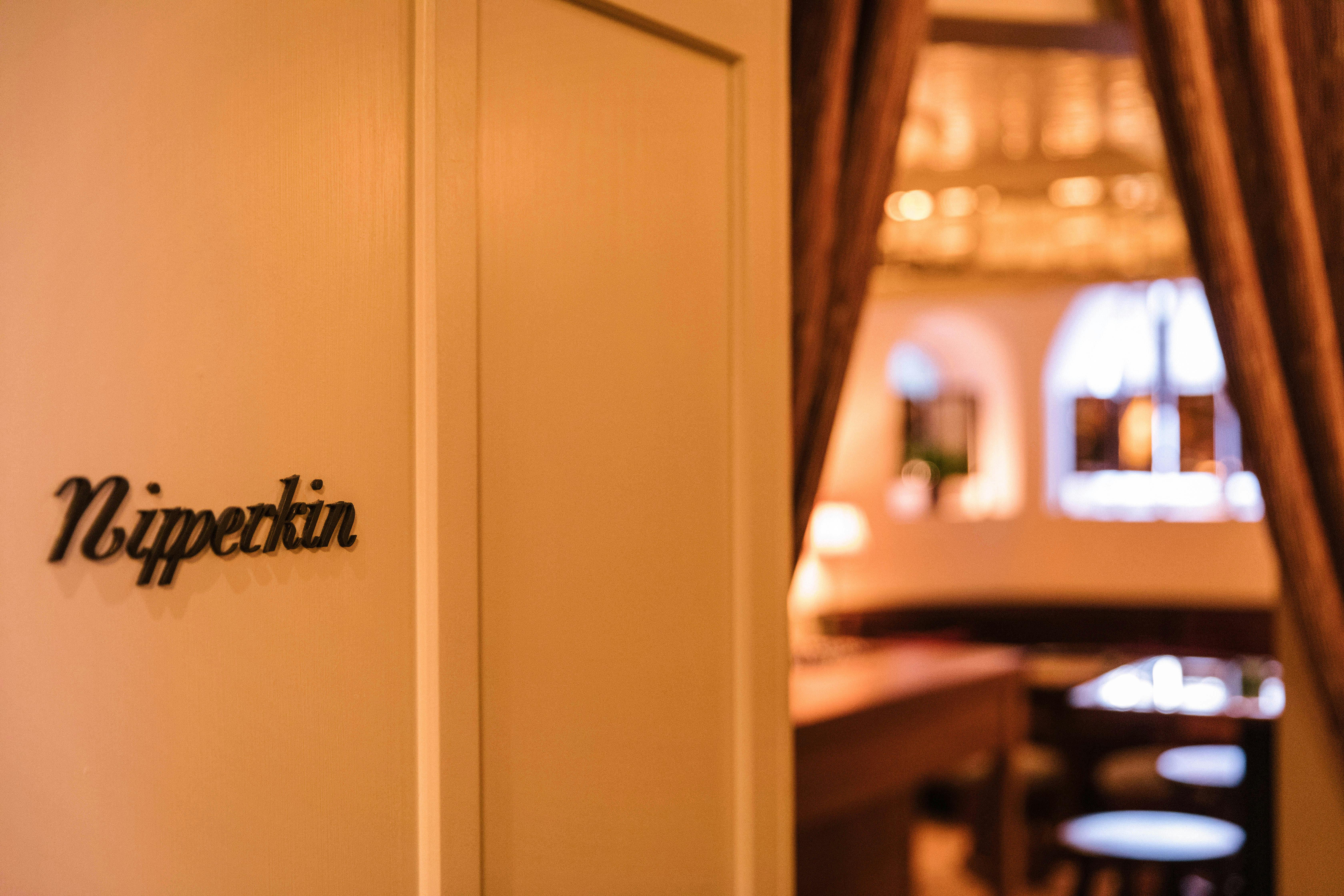 Stylish entrance of Nipperkin in NIJŪ, ideal for intimate private events and gatherings.