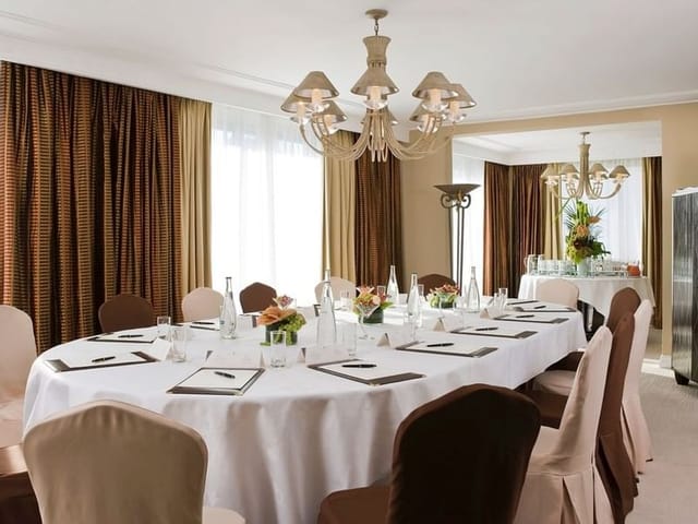 M. Monroe and J. Dean in a stylish meeting room, perfect for professional gatherings.
