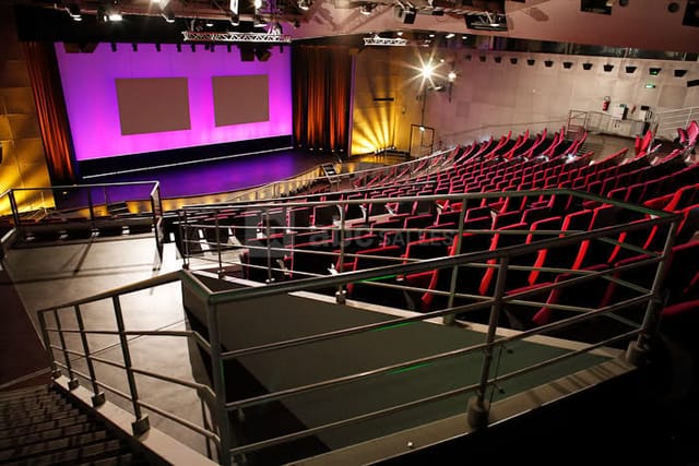 Auditorium at Cité des Sciences, featuring tiered seating for conferences and presentations.