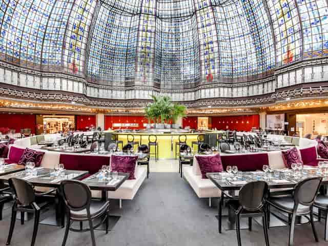 Brasserie La Coupole with grand stained glass ceiling, ideal for upscale events and receptions.