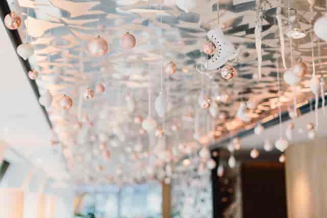 Elegant Angler Restaurant ceiling with rose gold ornaments, perfect for upscale events.