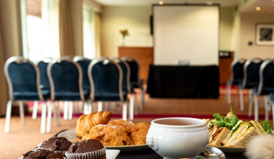 Meeting space at Sedgefield Racecourse with pastries for networking event. - Banner