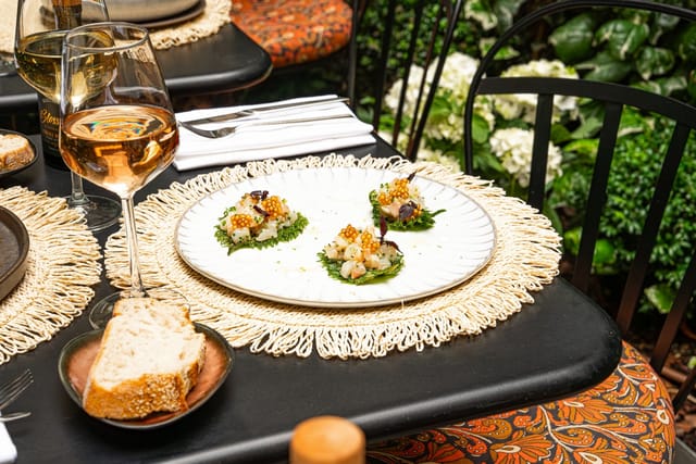 Elegant dining table at Restaurant Blossom, Sofitel Paris, perfect for events and gatherings.