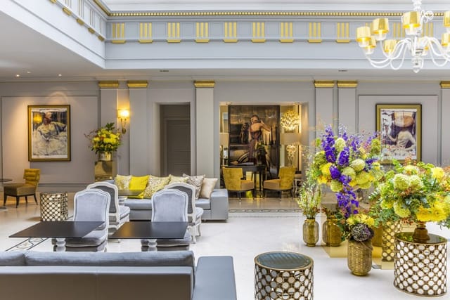 Elegant library event space in Sofitel Paris with floral displays for upscale gatherings.