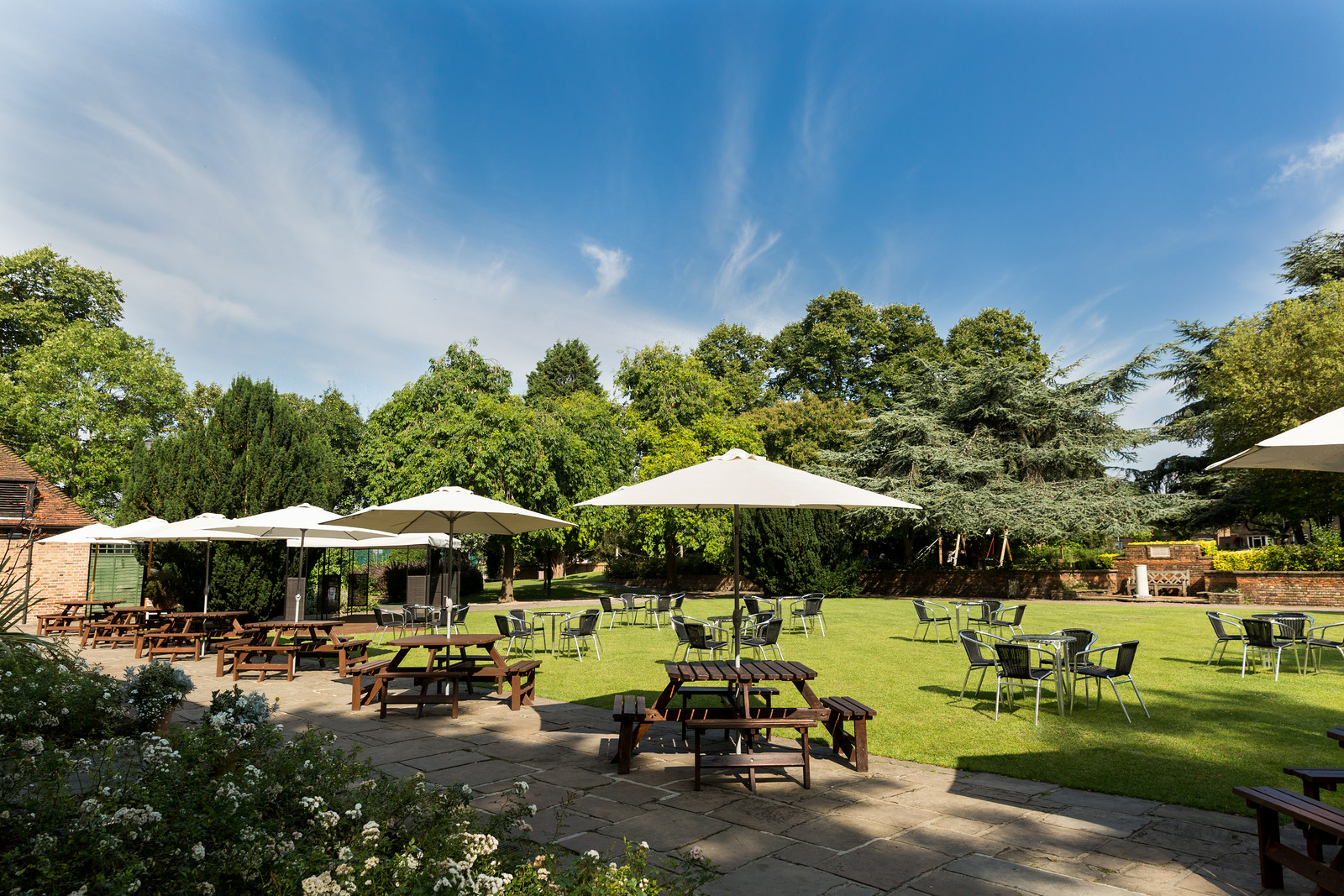 Spacious Tudor Barn Eltham front lawn venue with greenery for outdoor events. - Banner