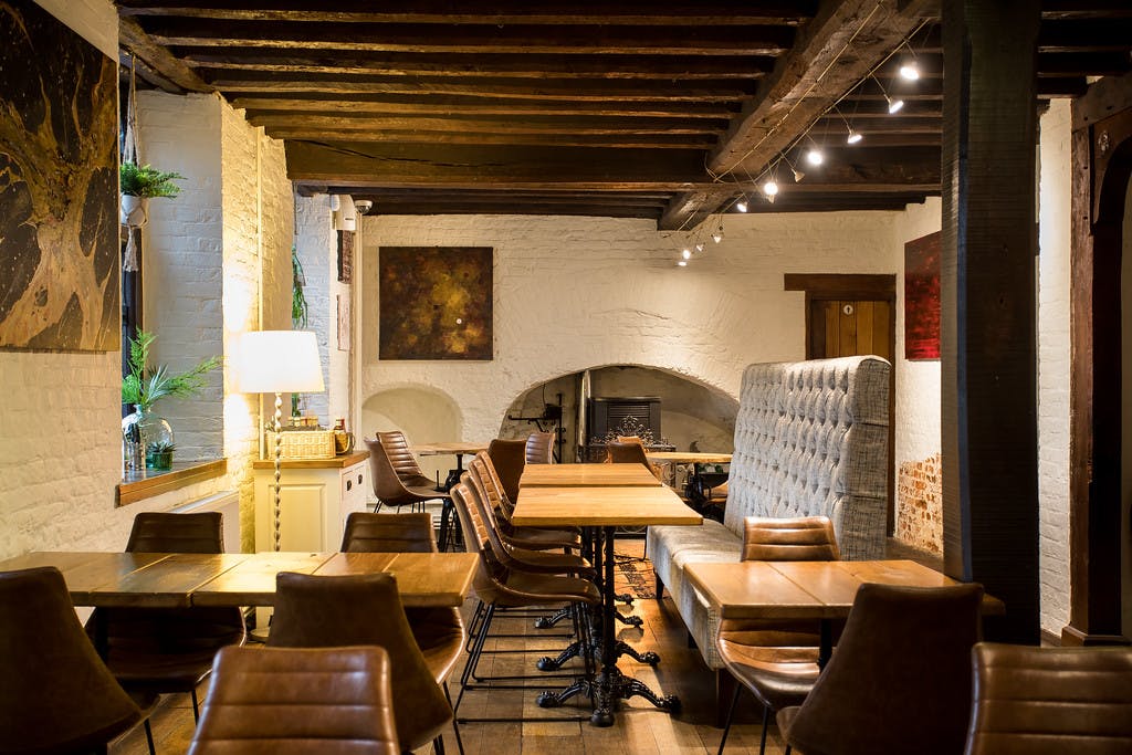 Cozy Gastro Pub meeting space in Tudor Barn Eltham, ideal for events and brainstorming.