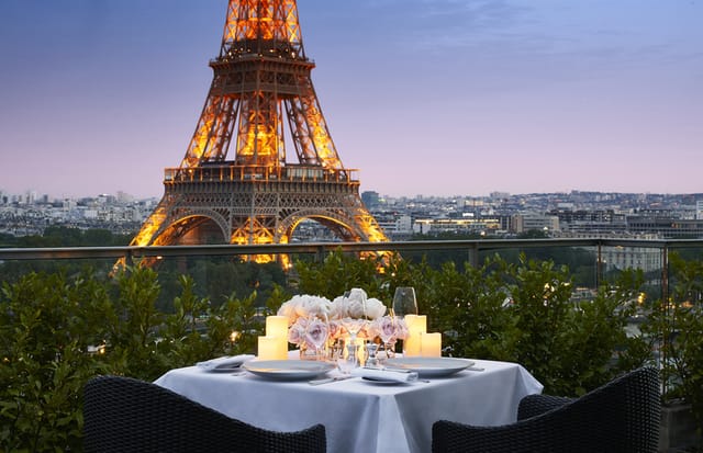 Rooftop dining at Shangri-La Paris with Eiffel Tower backdrop, perfect for romantic events.