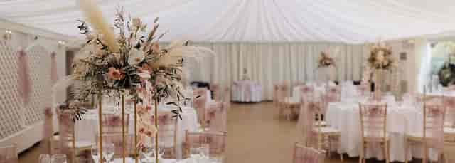 Elegant reception room with floral centerpieces, perfect for weddings and upscale events.