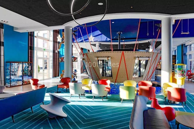 Vibrant French Garden lobby at Grand Magic Hotel, ideal for creative meetings and networking.