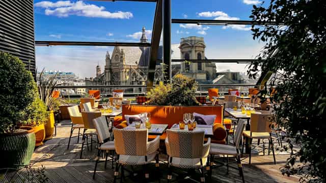 Gutenberg salon rooftop venue with vibrant seating and city views for upscale events.