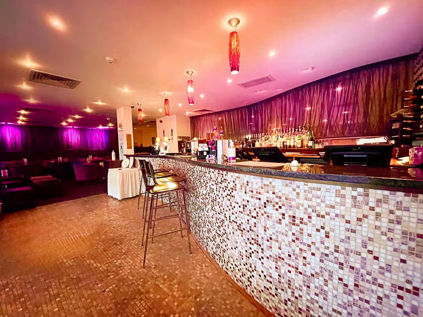 Stylish bar area in Zari Restaurant, ideal for networking events and cocktail receptions.