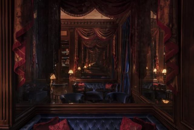 Elegant bar in Maison Proust, featuring plush seating for upscale events and gatherings.