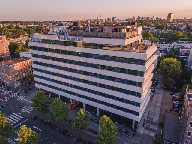 Modern Volkshotel with rooftop terrace, ideal for events and meetings in urban setting.