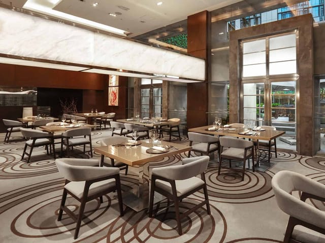 Elegant dining space at The Mira Hong Kong for corporate events and private gatherings.