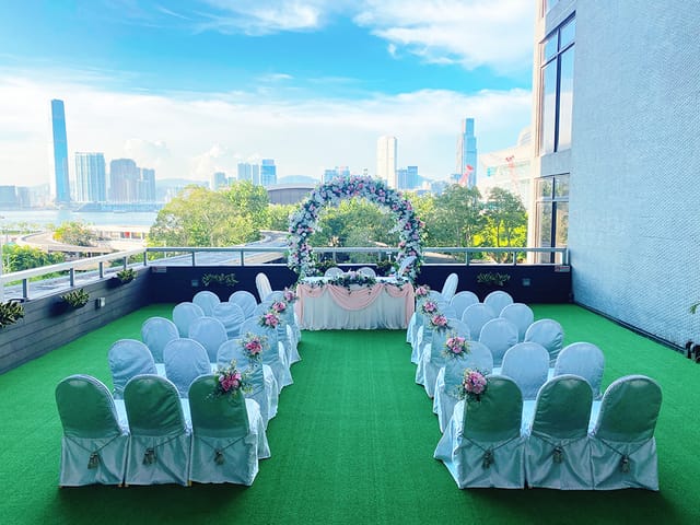 Outdoor wedding venue at The Harbourview with floral arch and elegant seating.