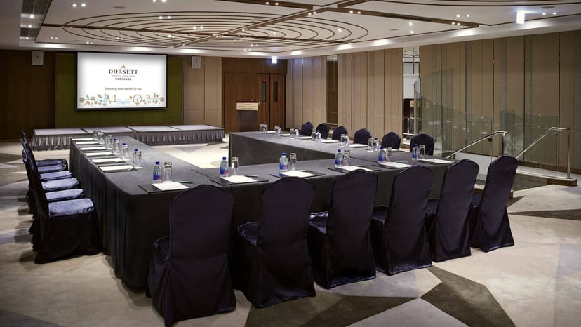 Meeting room with U-shaped table setup for corporate events and workshops at Dorsett Wanchai.