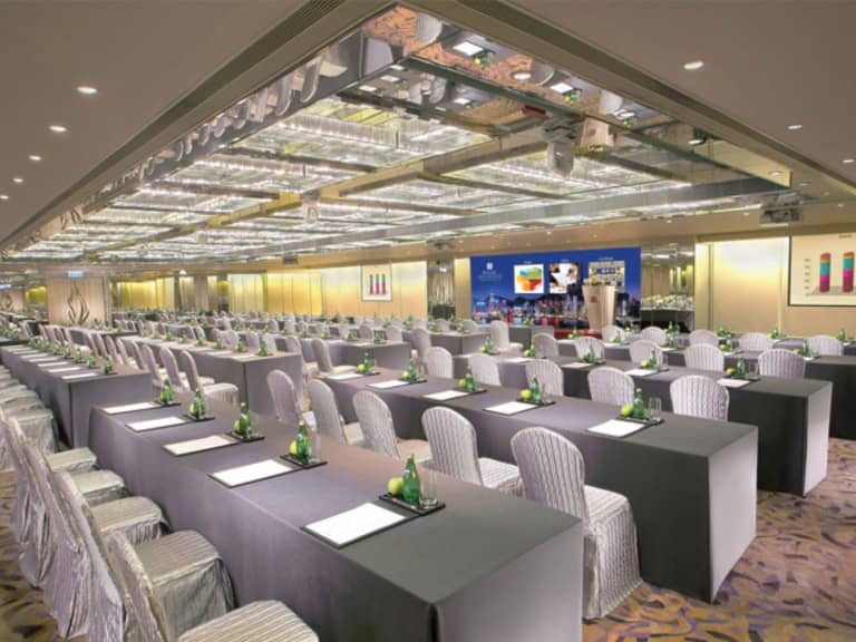 Regal Ballroom setup for a professional seminar with organized tables and bright lighting.