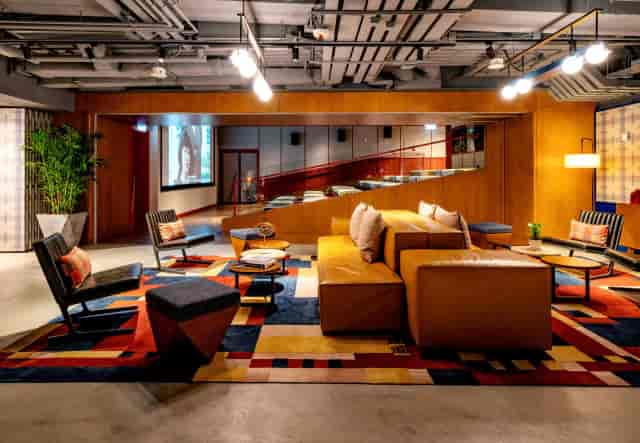 Anita in a stylish lounge at Eaton Hong Kong, perfect for networking events and meetings.