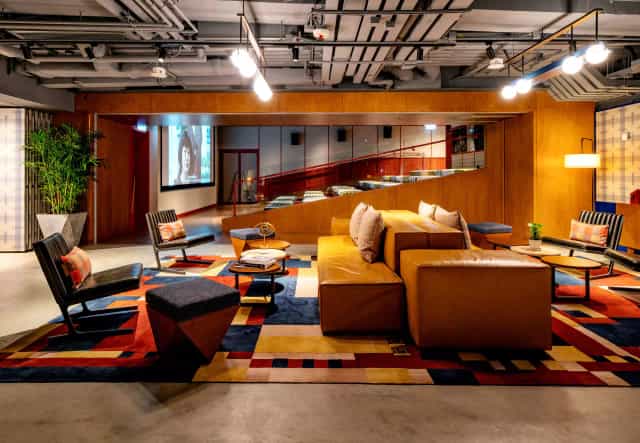 Anita in a stylish lounge at Eaton Hong Kong, perfect for networking events and meetings.