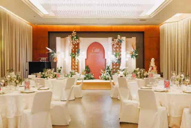 Elegant event space with round tables and floral centerpieces in Eaton Hong Kong.