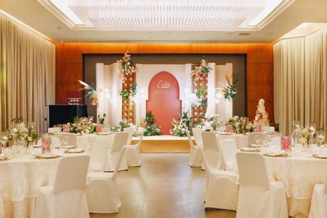 Elegant event space with round tables and floral centerpieces in Eaton Hong Kong.