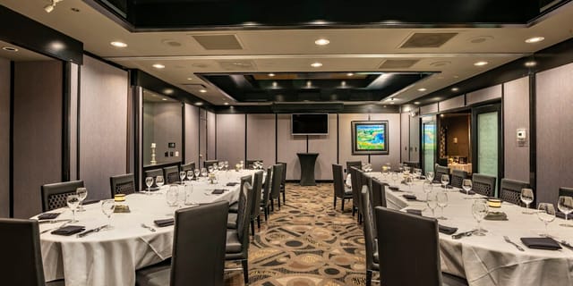Private dining room at Morton's The Steakhouse, elegant setup for corporate events.