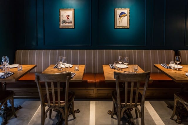 Private dining room at The Optimist, featuring elegant decor for intimate events.