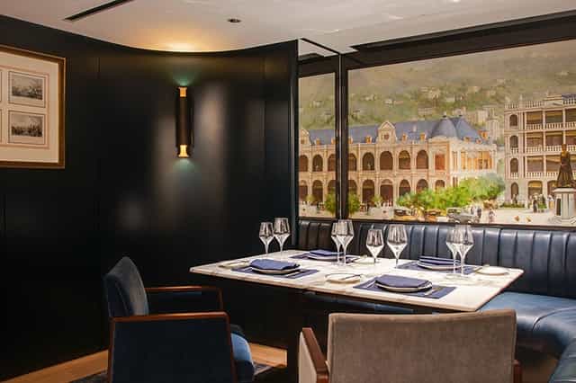 Elegant private dining room with marble table for exclusive corporate events.