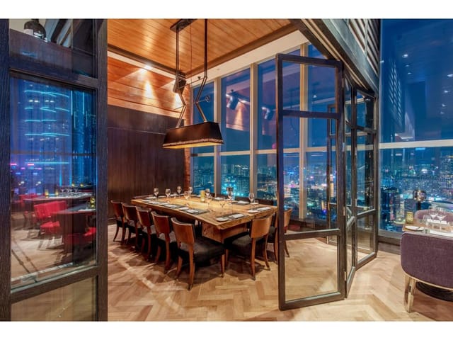 Private dining room in Wooloomooloo with panoramic city views for exclusive events.
